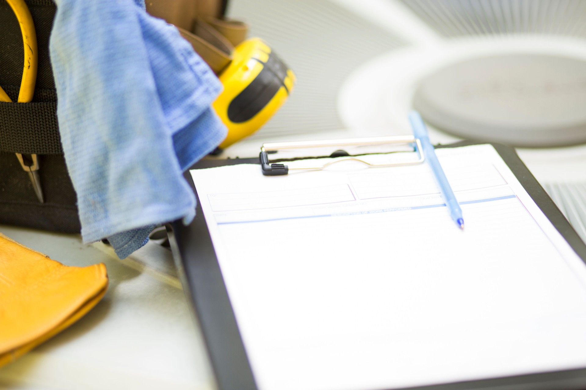 Air conditioning service personnel keep home owner unit running efficiently to help save carbon footprint.